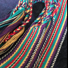 Load image into Gallery viewer, Colorful, tablet woven strap - southwest motif in turquioise,purple, gold and flame red. with colorful, braided, tassel ends.
